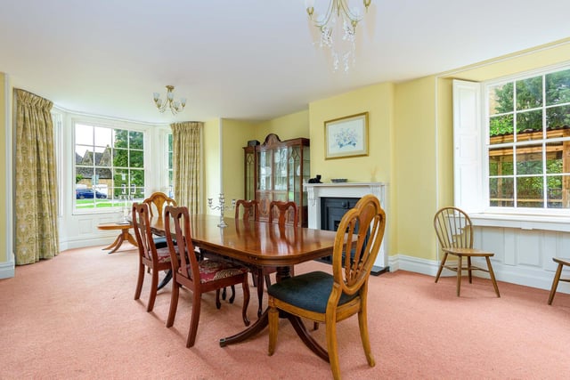 The traditional dining room offers plenty of space and light.