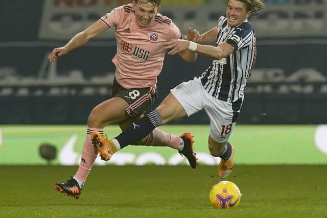 Sander Berge of Sheffield United tussles Conor Gallagher of West Bromwich Albion during the Premier League match at The Hawthorns, West Bromwich: Andrew Yates/Sportimage