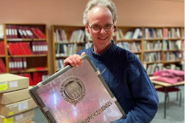 The mysterious book was handed over to Sheffield archivist, Robin (Photo: Sheffield City Archives)