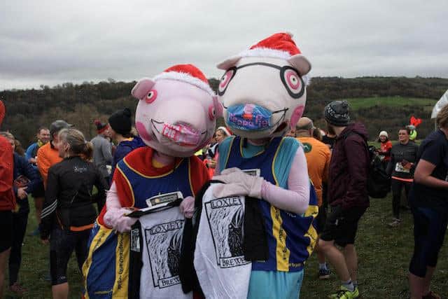 Mark and Carol Simpson ran as Daddy and Mummy Pig from children's TV hit Peppa Pig at the Percy Pud.
Picture by Ian Eyre