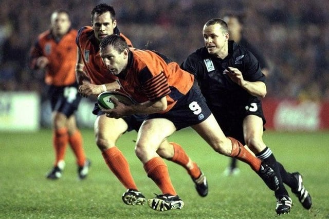 Gary Armstrong of Scotland can be seen here being chased down by Christian Cullen of New Zealand during the Rugby World Cup match played at Murrayfield in Edinburgh, on 24 October 1999.