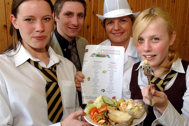 The Hayfield School pupils Katy Grice-Exton (left) and Sarah Bray, both aged 15, with their designer dish that made it onto the school menu in 2005, pictured with food technology teacher Chris Lord and catering manager Gill Farmery.