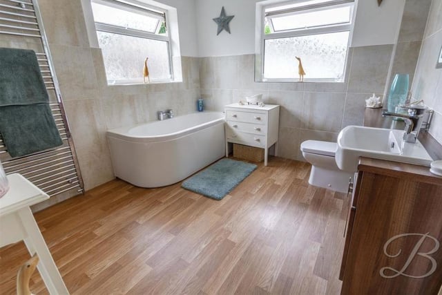 It's hard to fault the family bathroom. Pleasantly presented, it boasts a vanity unit, bath, double shower, low-flush WC and heated towel-rail.