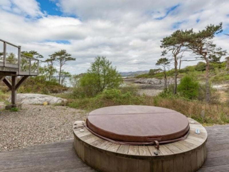 Enjoy a soak in the hot tub after a day walking the Highland countryside.