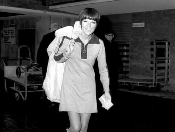 Mary Quant leaves the airport and heads for Amsterdam in  1966