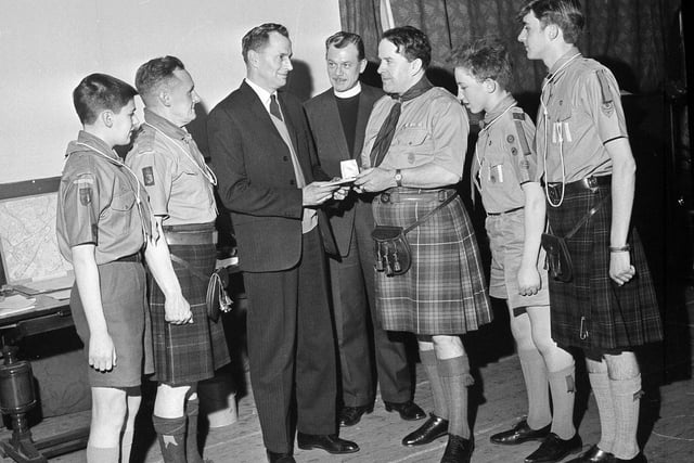 A group of Dalry and Haymarket boy scouts receive their Queen's Awards in January 1964.