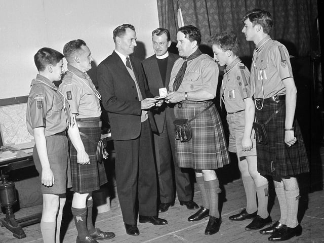 A group of Dalry and Haymarket boy scouts receive their Queen's Awards in January 1964.