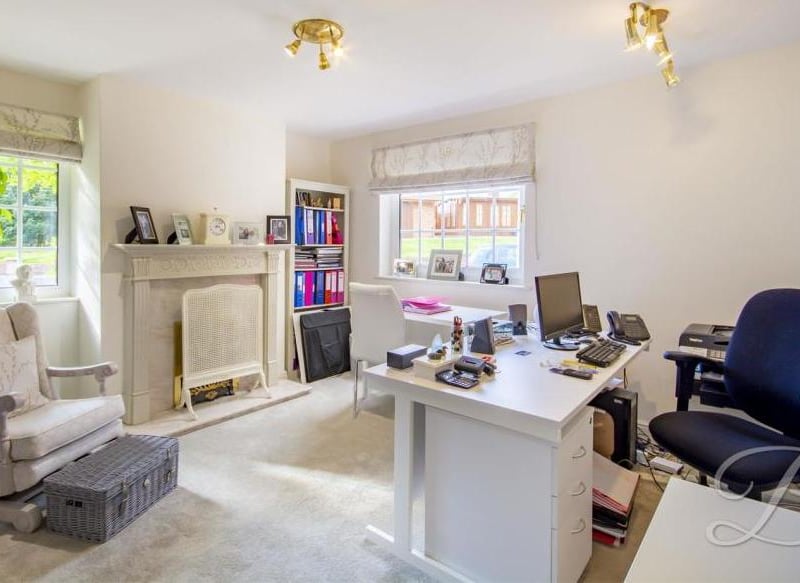 The property's office would be a pleasure to work in, as you can see. It includes a carpeted floor, dual-aspect windows and feature fireplace with surround.
