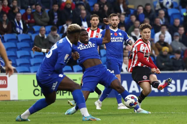 James McAtee of Sheffield United threads a pass through Cardiff City's defence: Darren Staples / Sportimage