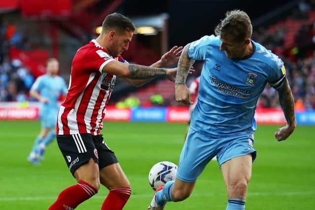 Billy Sharp of Sheffield United tussles with Kyle McFadzean of Coventry City: Simon Bellis / Sportimage