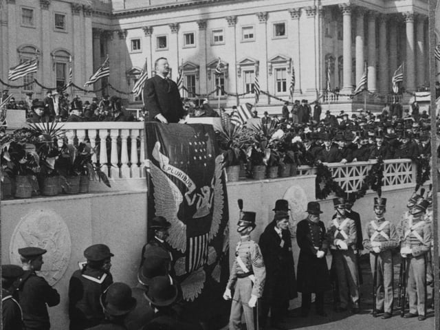 US President Theodore Roosevelt (1858 - 1919) makes his inaugural address at the start of his second term, at the East Portico of the United States Capitol in Washington, DC, 4th March 1905. His speech includes the words 'We wish peace because it is right'.