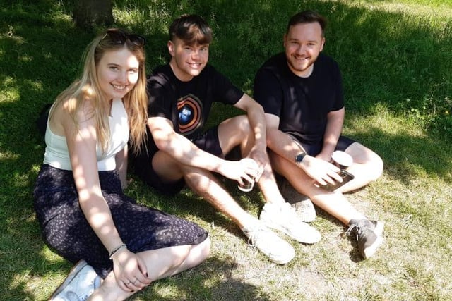 These students found some shade to sit in under a tree near The Diamond building