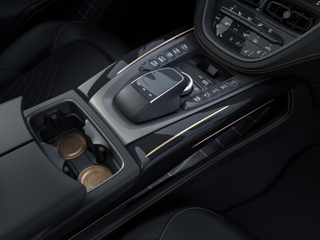 Polished copper cupholder inserts are one of many details made using copper from the original Bowmore stills.
