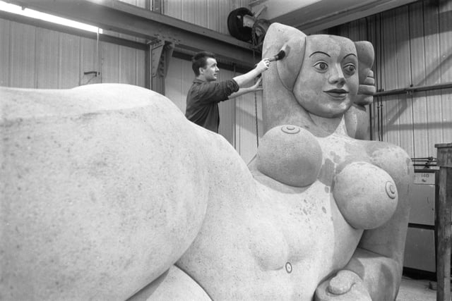 Dhruva Mistry's huge sculpture of a nude woman ('The Reclining Woman') is spruced up for the Glasgow Garden Festival in March 1988.