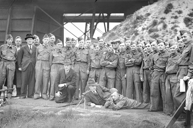 These men were all members of the Volunteer Defence Corps and they were practising for parachute service in this 1940 photo.