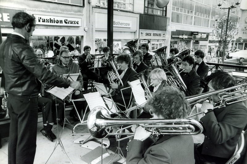 The Oughtibridge Brass Band play at the bandstand on The Moor, Sheffield, in 1984