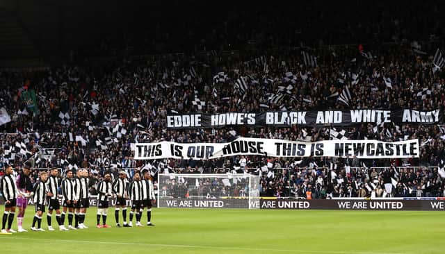 The Newcastle United team line up as fans display a welcome message to new manager, Eddie Howe, who was not able to attend after testing positive for Covid-19 prior to the Premier League match between Newcastle United and Brentford at St. James Park. (Photo by George Wood/Getty Images)