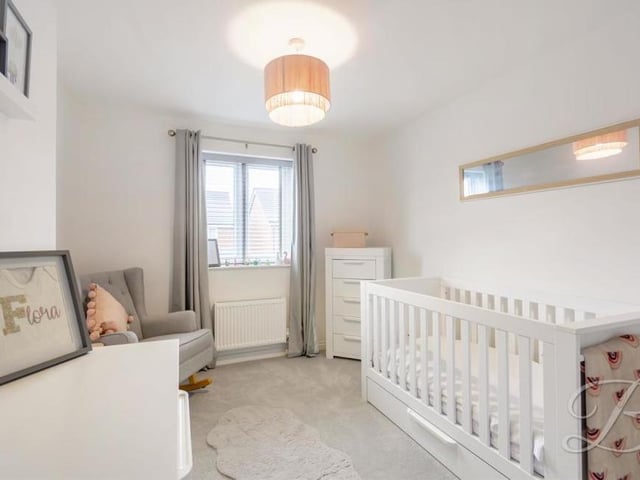 The second bedroom at the £325,000 property has space for a conventional bed or a cot. There is carpeted flooring, a central-heating radiator and a window to the front of the house.