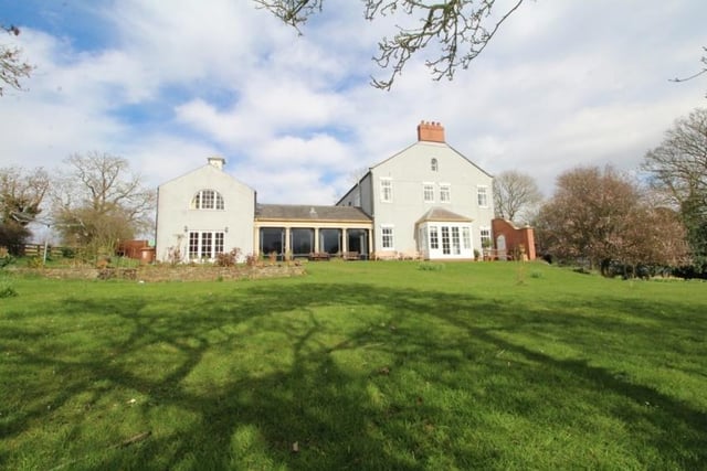 This property is set in 2.065 acres of land, with private landscaped gardens as well. Approaching The Grove is a circular gravel driveway, with beautiful stone steps that lead up to the original front door