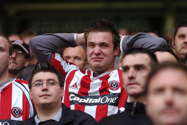 A Blades fan nervously awaits the final whistle during his side's game with Wigan Athletic, which United lost 2-1 to be relegated to the Championship. Photo: Rui Vieira/PA Wire.
.