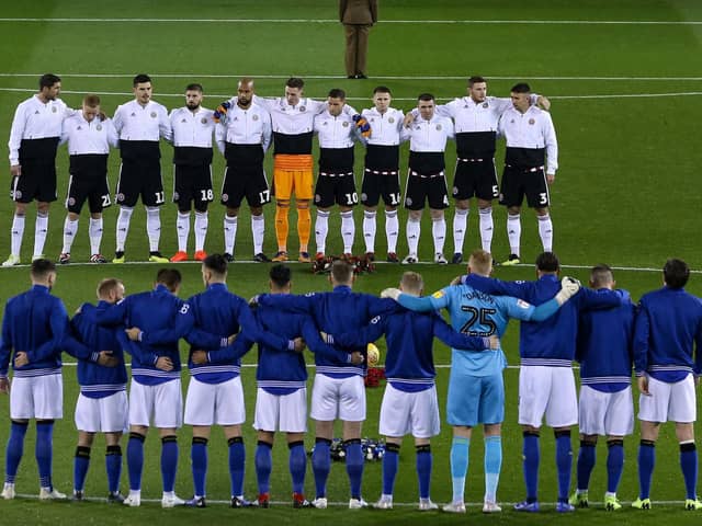 Sheffield United and Wednesday players line up for a minute's silence ahead of a derby game: James Wilson/Sportimage