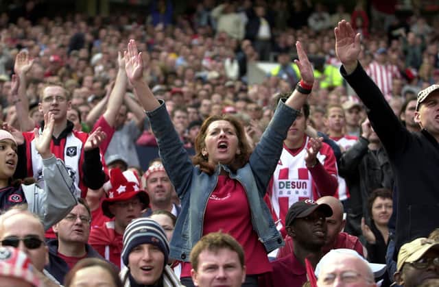 Sheffield United fans cheer their team on at the FA Cup semi final against Arsenal in 2013