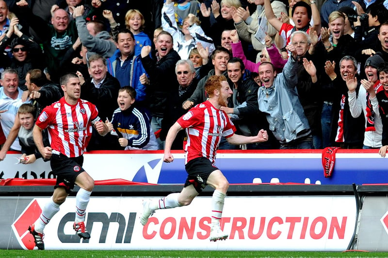 Stephen Quinn celebrates his opening goal in font of the Blades fans