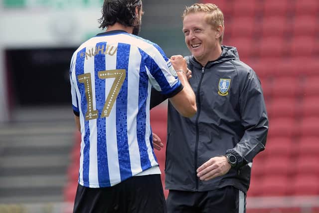 Sheffield Wednesday boss Garry Monk shares a smile with Atdhe Nuhiu. Pic: Steve Ellis