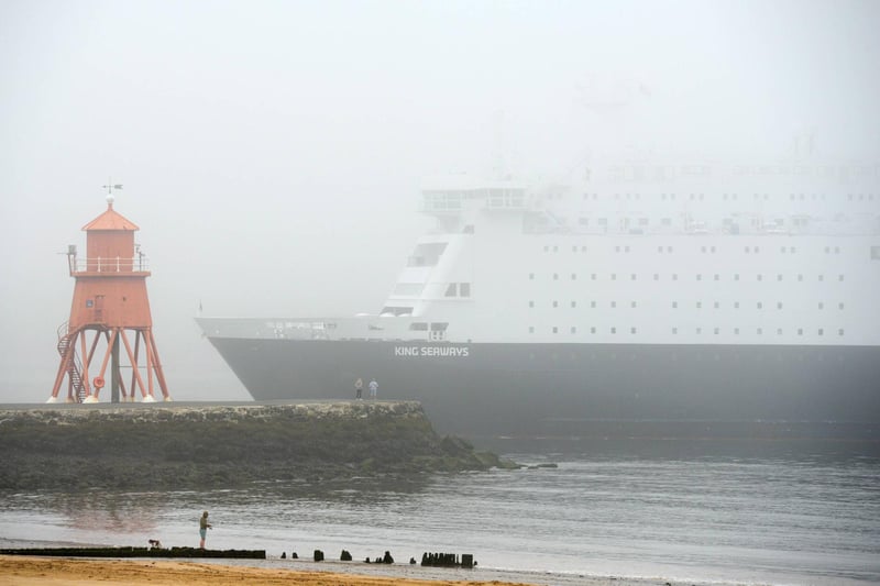 The ship is still a majestic sight as she cuts through the fog.
