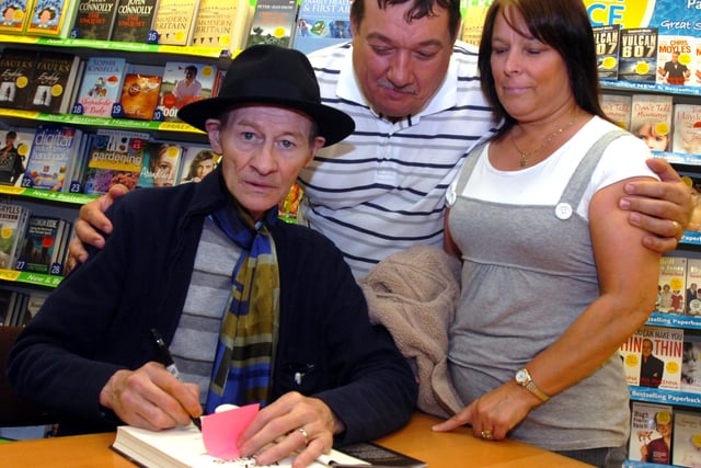 Snooker legend Alex 'Hurricane' Higgins at his book signing at WH Smith, Fargate, Sheffield with fan John Unwin on June 7, 2007
