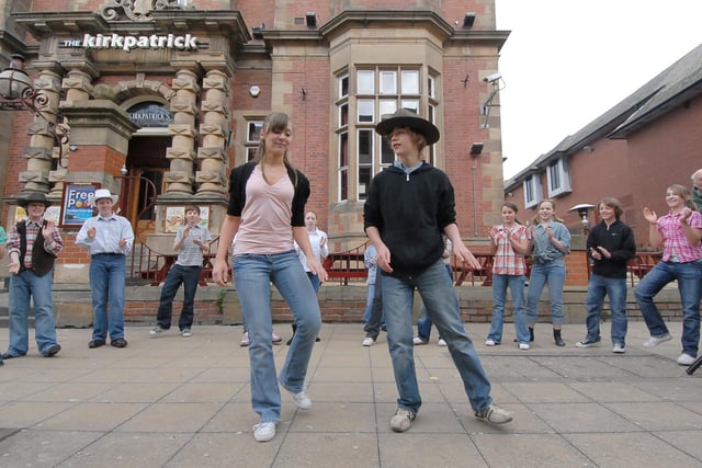 Children from Westovians are pictured performing a number from their stage show Oklahoma in King Street in 2008.