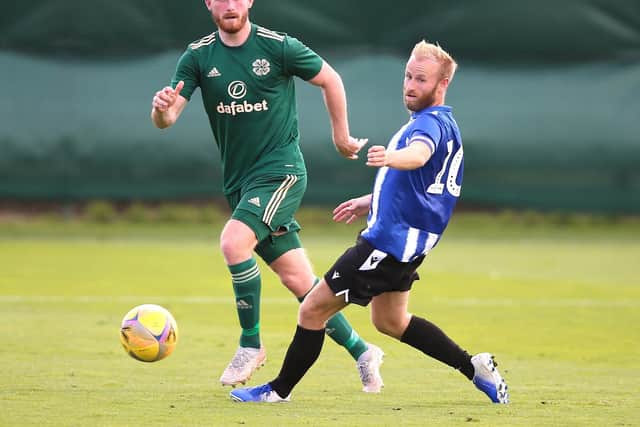 Celtic's Tony Ralston (left) and Sheffield Wednesday's Barry Bannan battle for the ball during a pre-season friendly.