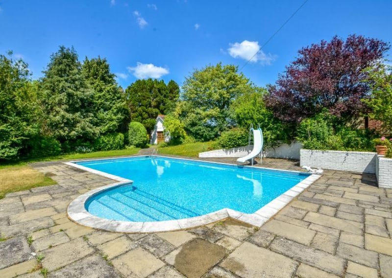 The house comes with a heated outdoor swimming pool.