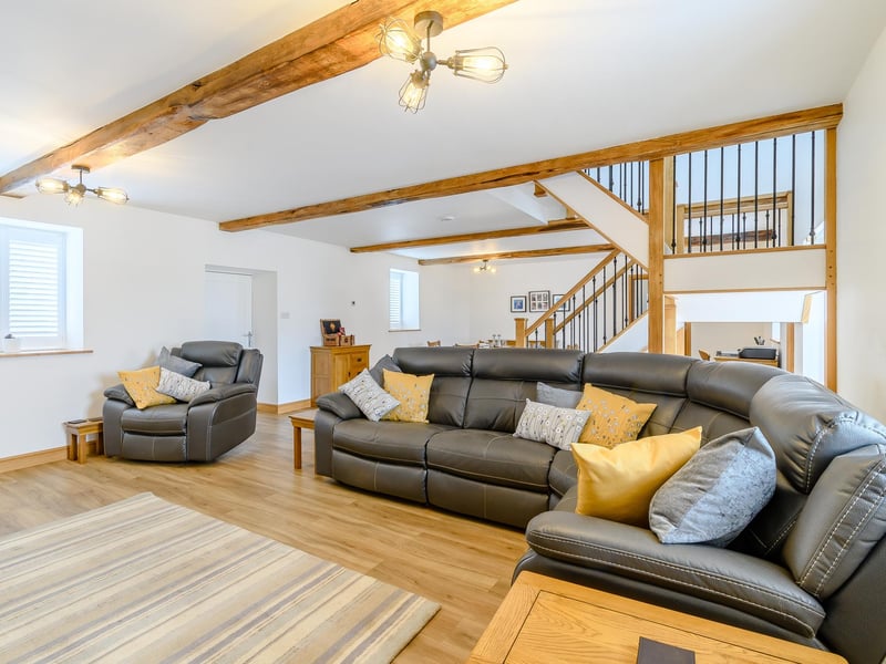 The main living space in the home that is part of the Grade II listed stone barn at Warren Farm. The dwelling has been completed to a high standard.