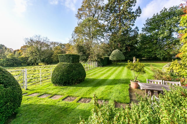 The house is set within 15 acres of private lawned gardens which lead on to the parkland and down the Thirkleby Beck.
