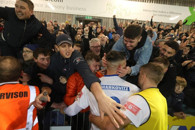 Diego de Girolamo is mobbed at the final whistle.