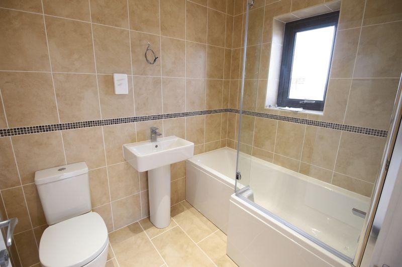 Three-piece suite including a bath, wash hand basin and WC.