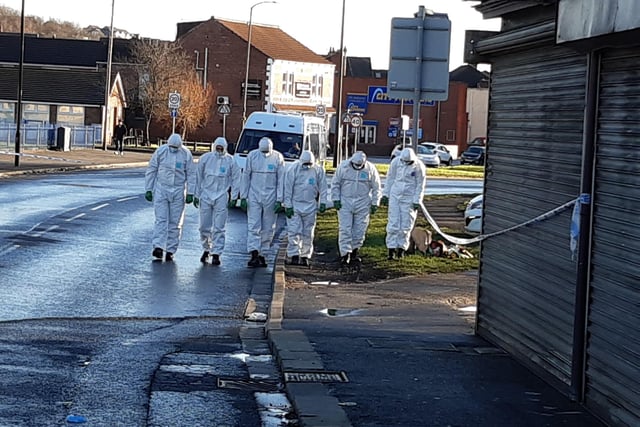 Police at the scene of the alleged murder on Wath Road Mexborough today. Crime scene officers carry out a search. The alleged shooting  happened on January 11