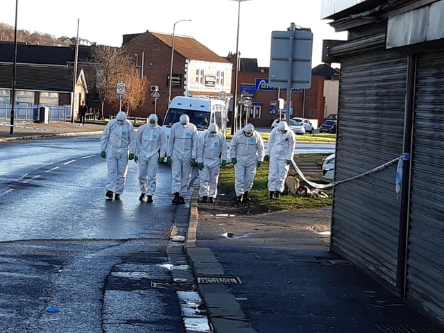 Police at the scene of the alleged murder on Wath Road Mexborough today. Crime scene officers carry out a search. The alleged shooting happened on January 11