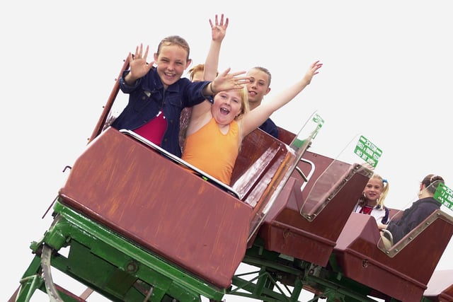 Emma Harvey, aged 12, and Claire Pinder, aged nine, both of Edenthorpe,  enjoy the ups and downs of this ride, at the Hungerhill Summer School Extravangza in 2001