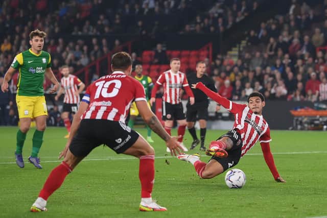 SHEFFIELD, ENGLAND - SEPTEMBER 14: Morgan Gibbs-White scores their team's first goal during the Sky Bet Championship match between Sheffield United and Preston North End at Bramall Lane on September 14, 2021 in Sheffield, England. (Photo by Laurence Griffiths/Getty Images)