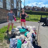 Litter pickers Rebecca Watts, left, and Sam Bough with some of the rubbish they cleared on their 10.5-hour training session