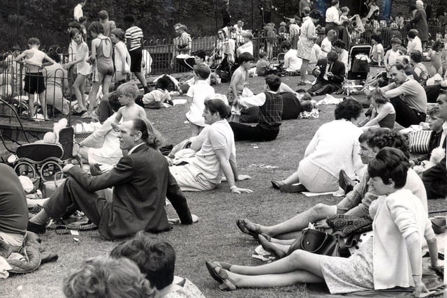 Sheffield people relaxing in the hot weather during the Whit Bank Holiday at Millhouses Park in 1968.