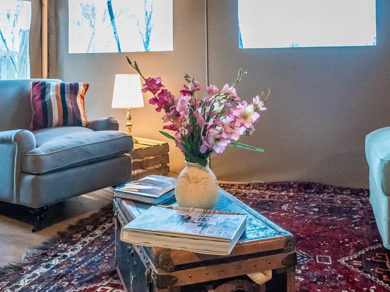 There is cushion-covered sofa and chair lounge area to curl up in with a good book.