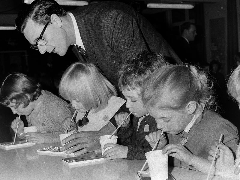 One from a children's party in the 60s - can you spot anyone you know?