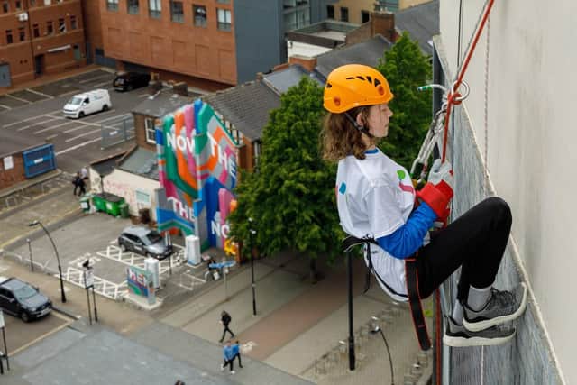 George Farnsworth abseils down Sheffield Hallam University's main building on Howard Street in aid of youth homelessness charity Roundabout (pic by Antony Baker - Focussing On Photography Ltd)