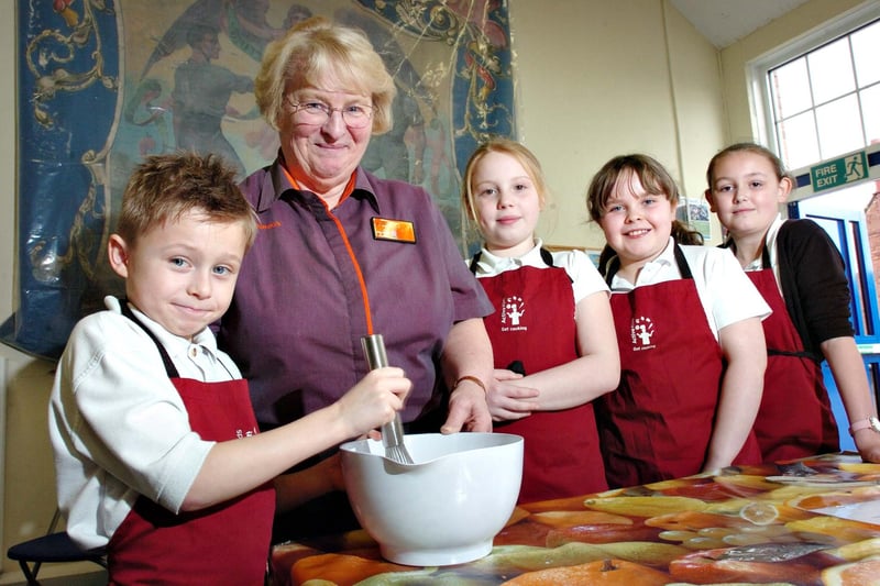 A 2012 scene at JFK Primary School where children were mixing the batter for their pancakes to go with their Fairtrade banana ice cream. Pictured is Lennon Conlon, 8, with Shirley Alderson from Sainsbury's, and left to right; Emily Gilmaney, 9, Holly Young, 8, and Kelly-Ann Gordon aged 10.