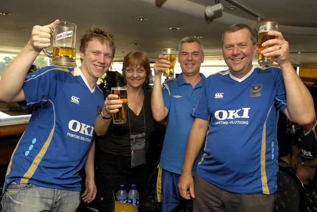 Pompey fans Craig Fryer, Pam Wood, Paul Kelly and Norman Fryer toast Pompey's success at The Royal Pacific Hotel.