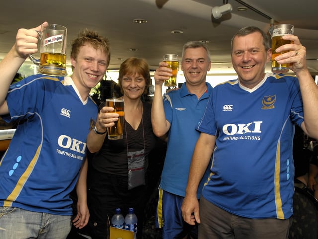 Pompey fans Craig Fryer, Pam Wood, Paul Kelly and Norman Fryer toast Pompey's success at The Royal Pacific Hotel.