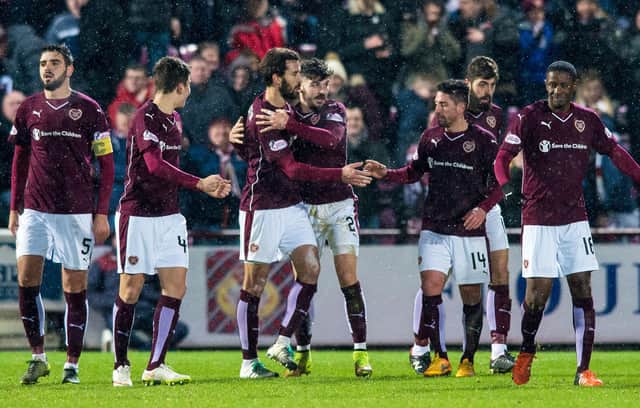 Hearts' Callum Paterson (4th from right) celebrates with his team-mates after scoring his side's fourth goal